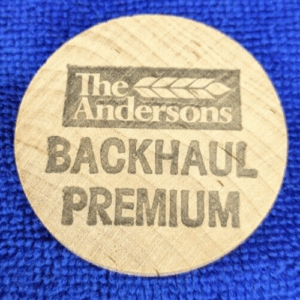 The Andersons Backhaul Premium Wooden Nickel Vintage Souvenir Advertisement