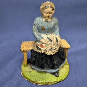 Vintage Cast Iron Figurine of Woman on Bench - Hand-Painted, Early 20th Century